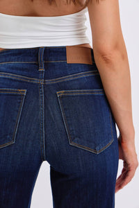 Close-up of blue jeans with a white background