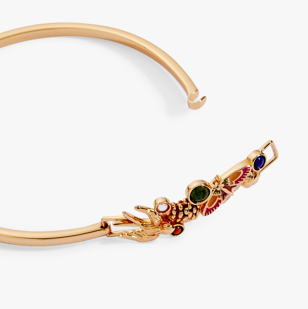 Gold bracelet with decorative elements on a white background