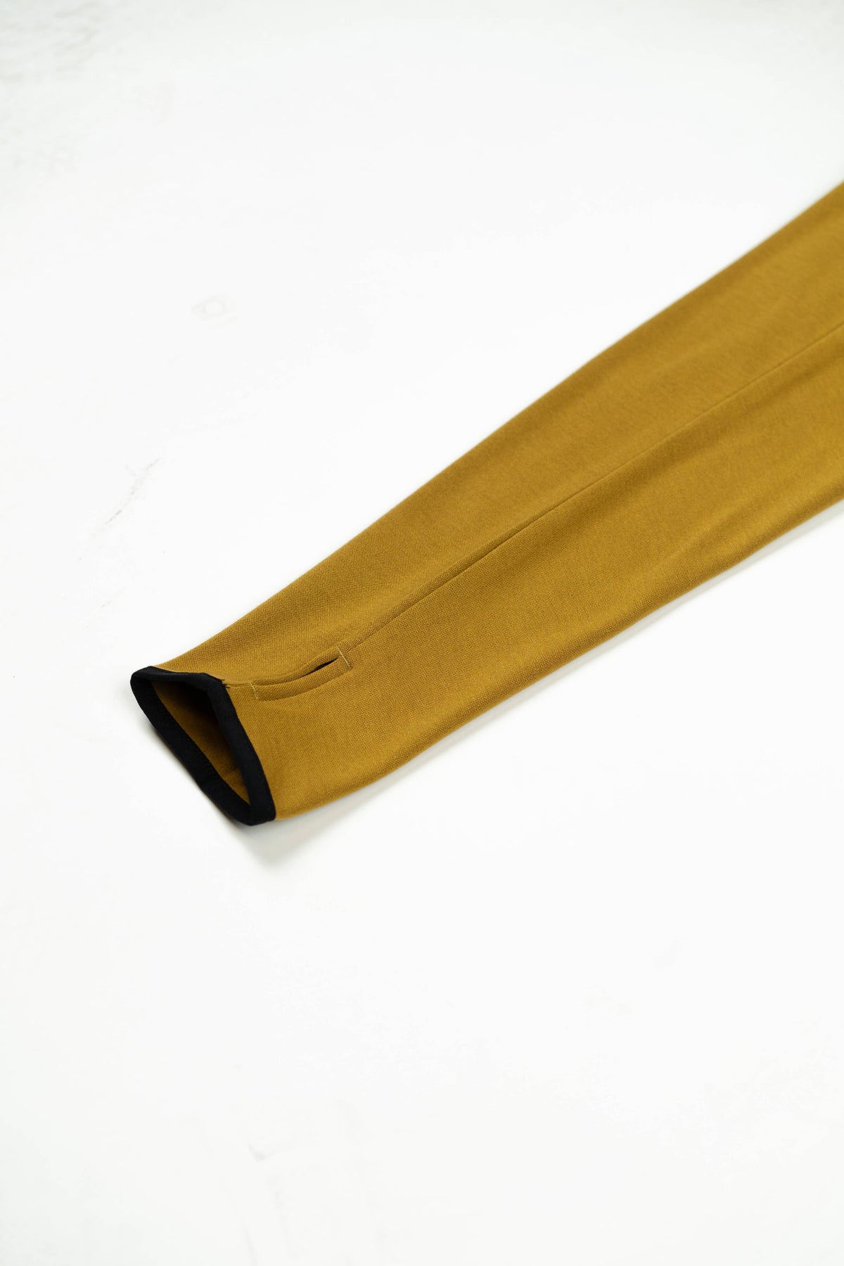 Mustard yellow sleeveless top on a white background