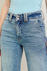 Close-up of blue jeans with a light background
