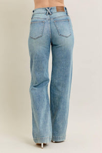 Light blue jeans on a beige background