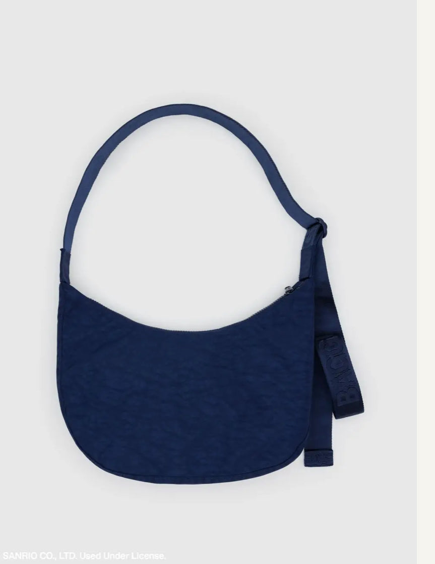 Navy blue textured handbag on a light gray background