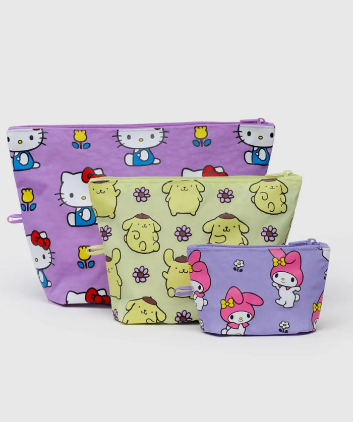 Three colorful pouches with cartoon character patterns on a white background
