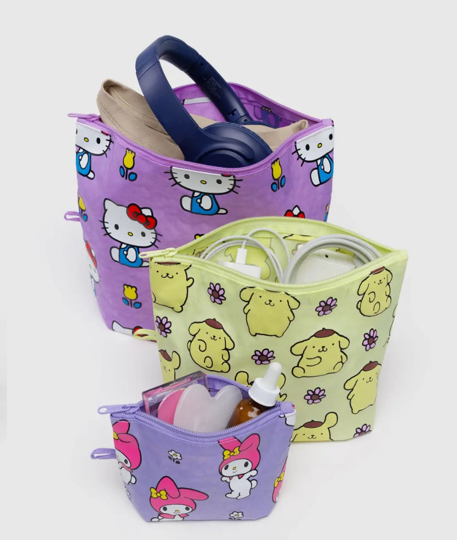 Three colorful bags with cartoon designs on a white background Hello Kitty
