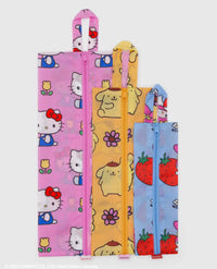 Three colorful bags with cartoon character patterns on a white background