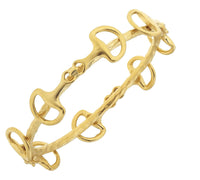 Gold bracelet with interlocking design on a white background