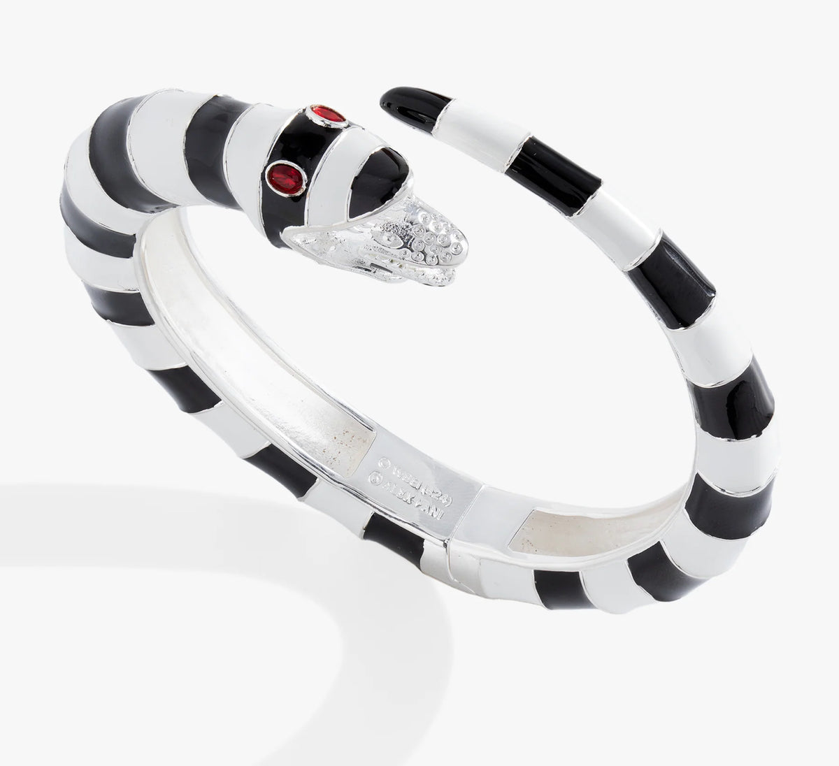 Black and white striped bracelet with a red gemstone on a white background