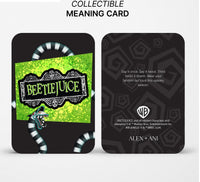 Collectible 'Beetlejuice' themed card with green and black design on a white background