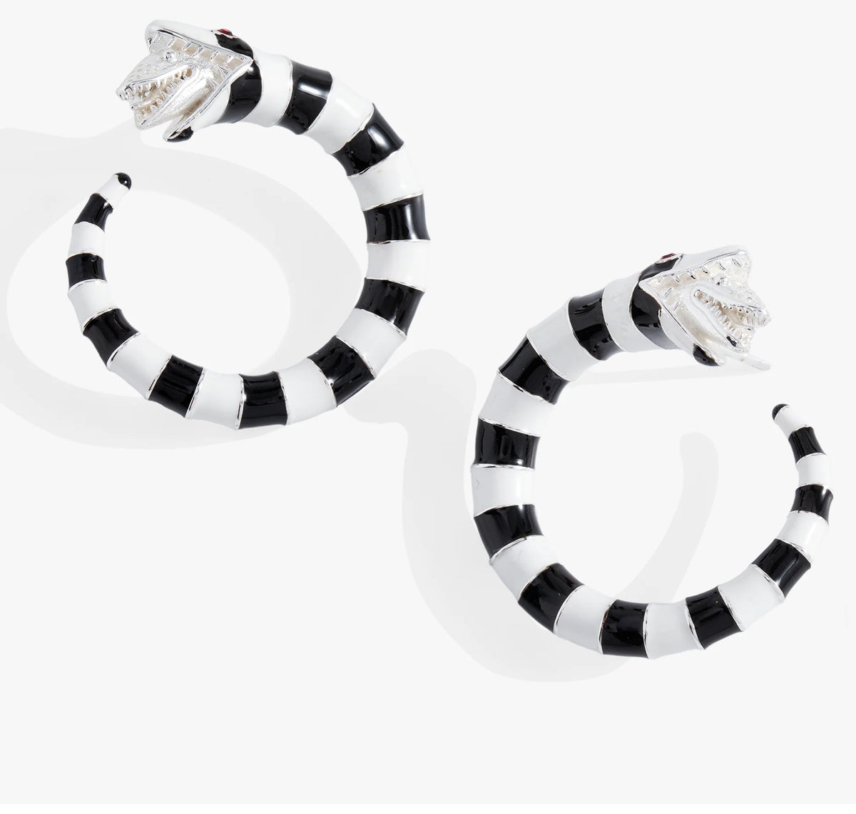 Black and white striped hoop earrings on a white background