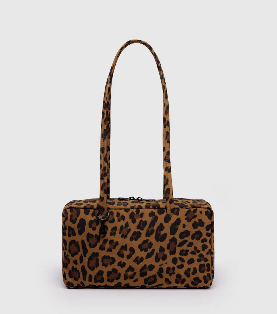 Leopard print handbag on a light gray background
