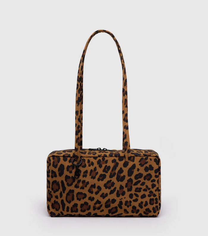 Leopard print handbag on a light gray background