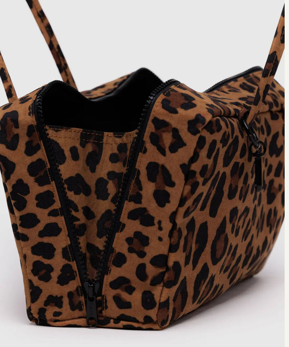 Leopard print bag with black zipper on a white background