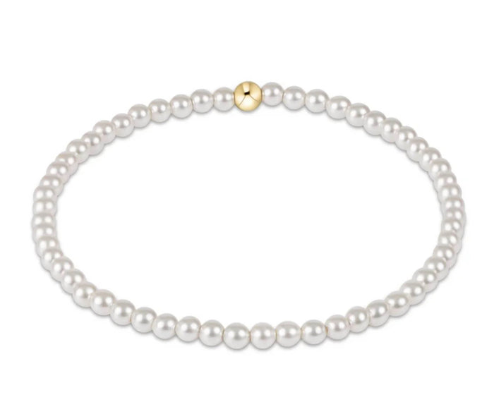 Pearl bracelet with a gold clasp on a white background