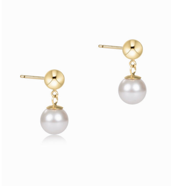 Pair of pearl earrings with gold posts on a white background