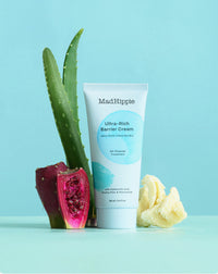 Mad Hippie Ultra-Rich Barrier Cream with aloe vera plant on a light blue background