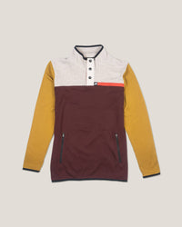 Multicolored pullover with maroon, yellow, and white sections on a beige background