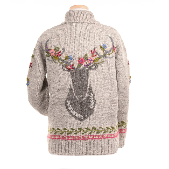Knitted sweater with deer design and floral details on a white background
